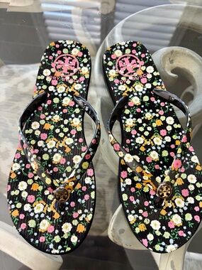 Tory Burch Black Floral Logo Flip Sandals with Pink Logo